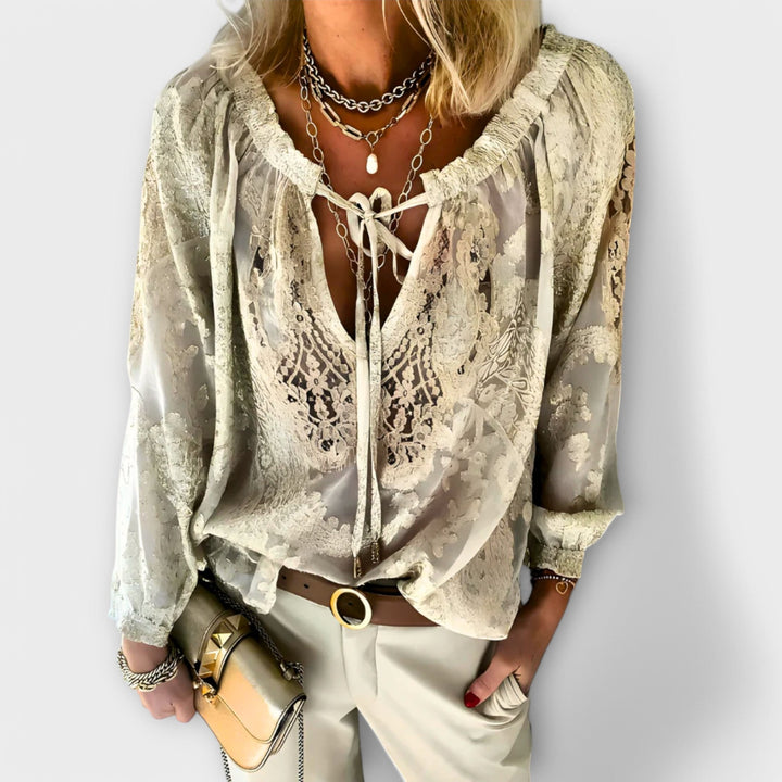 Flowing pink Brunetta blouse, a chic women's tie-neck top with long sleeves, ideal for a stylish summer or spring look.