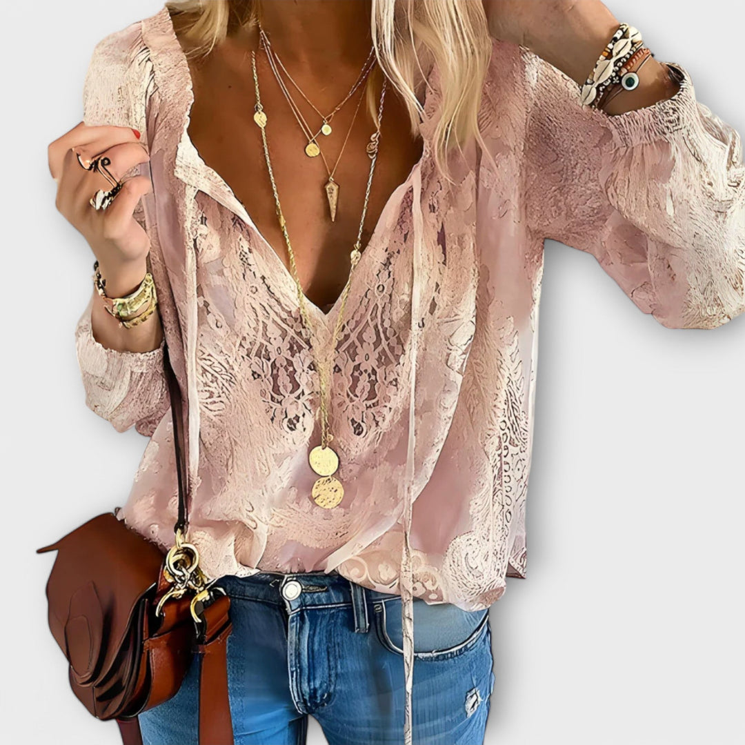 Women's Brunetta tie-neck blouse, an elegant long-sleeve top with a detailed design, perfect for a chic spring look.