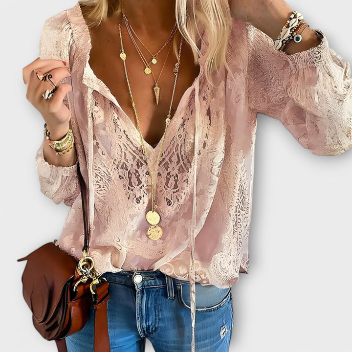 Women's Brunetta tie-neck blouse, an elegant long-sleeve top with a detailed design, perfect for a chic spring look.