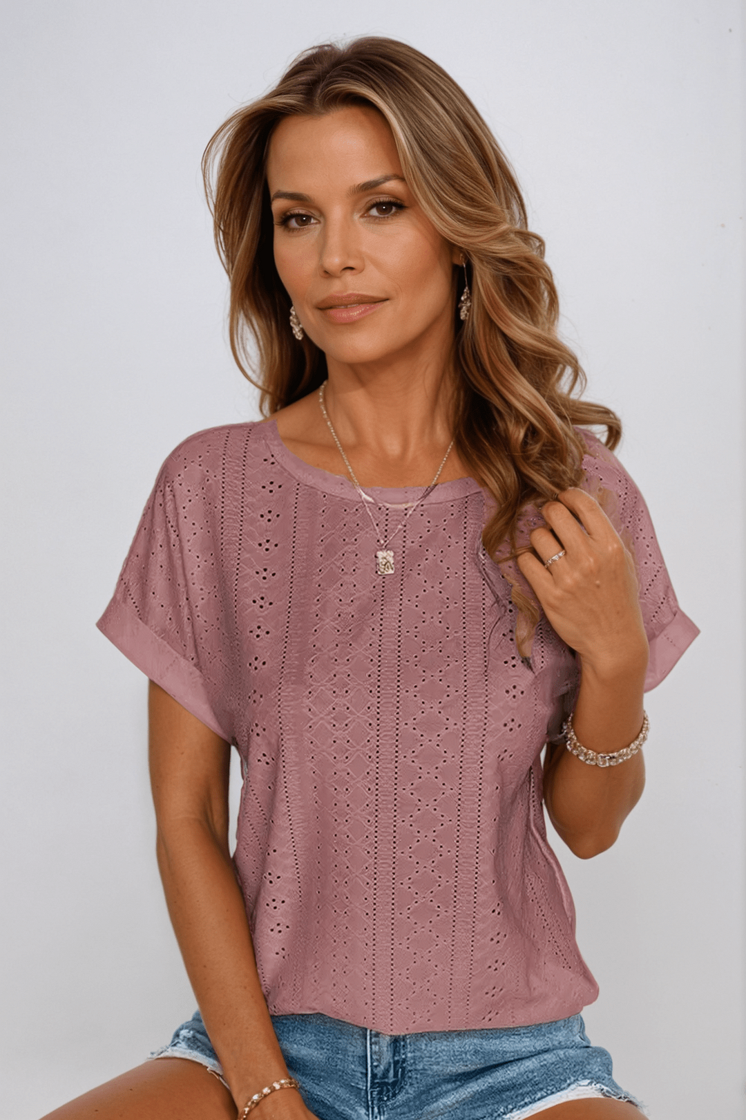Light green eyelet embroidered women's top, a comfortable and chic short sleeve crew neck shirt for summer.