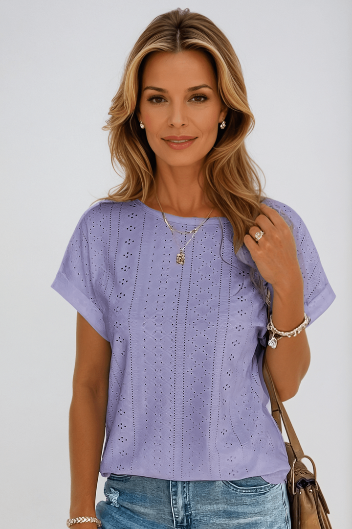 Classic black eyelet embroidered women's top featuring a crew neck and short sleeves for an elegant look.