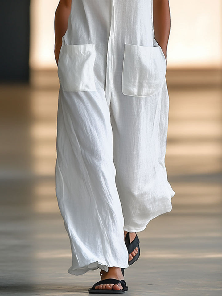 Stylish women's deep V-neck sleeveless white wide-leg jumpsuit with functional pockets, perfect for summer elegance.