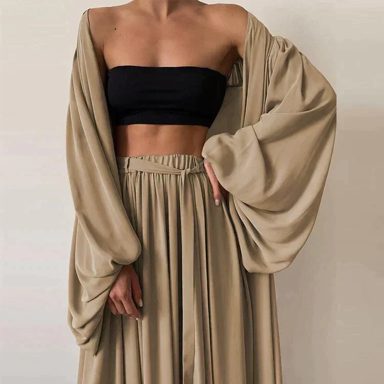 Stylish women's 3-piece summer outfit: blazer, top, and pants. Perfect for elegant office fashion or a refined spring look.