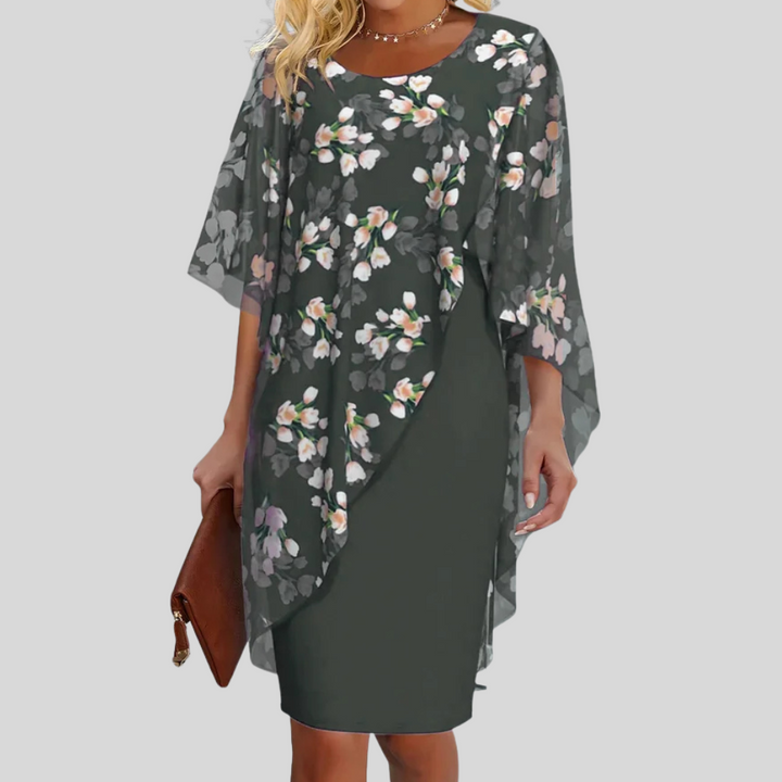 Chic women's sleeveless floral print summer dress, featuring a flattering A-line cut for elegant occasion wear.