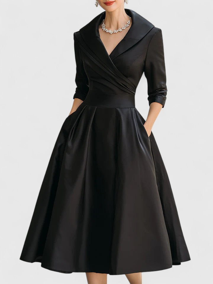 Sophisticated A-line midi dress for women. Ideal for wedding guests, cocktail parties & evening events. Features ruched design.