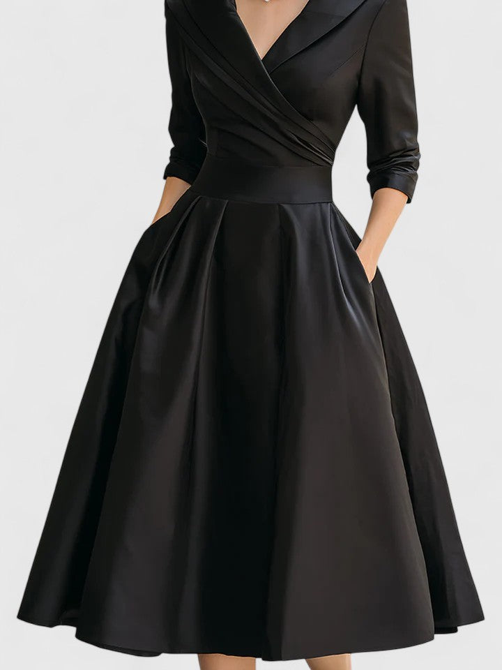 Elegant women's occasion midi dress with ruched bodice and wrap collar, suitable for formal wear or special events.