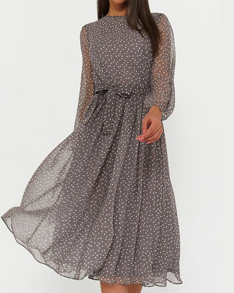 Elegant women's A-line polka dot dress with stylish lantern sleeves, perfect for spring and summer casual wear.