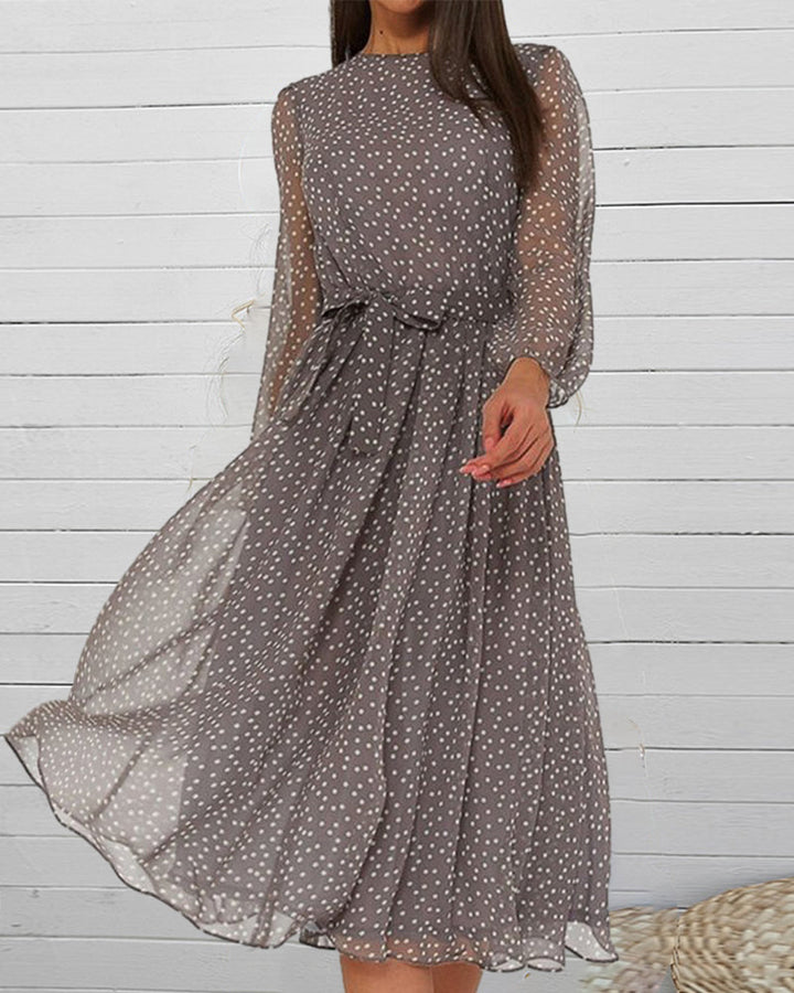 Comfortable A-line women's dress with chic polka dots and lantern sleeves, ideal for elegant everyday wear.