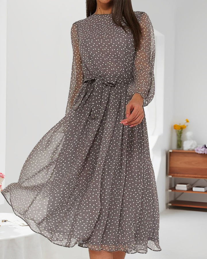Relaxed fit A-line polka dot dress for women, featuring elegant lantern sleeves, suitable for spring and fall fashion.