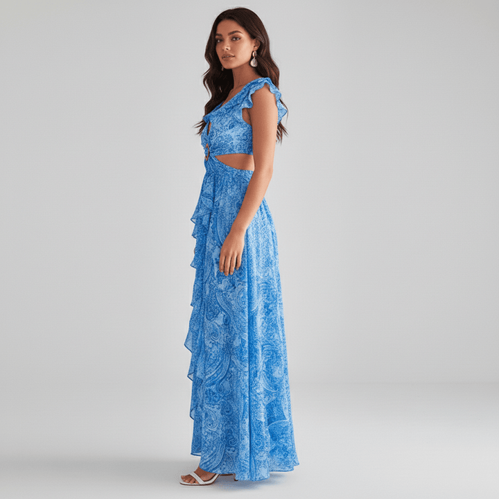 Full-length vibrant abstract print maxi dress for women, with trendy cut-outs and ruffled sleeves, perfect for guests.