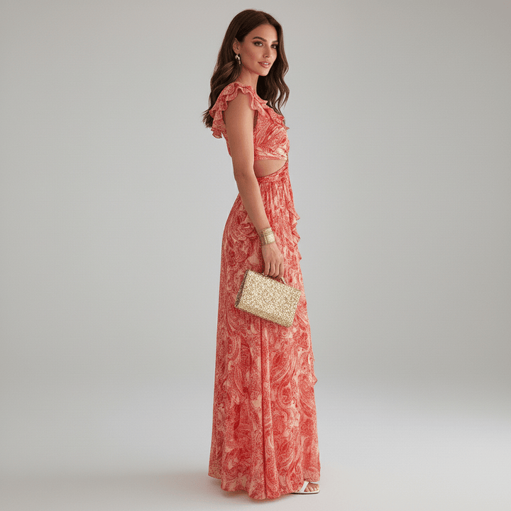 Fashionable women's abstract print maxi dress with a sophisticated cut-out and flowing ruffles, ideal for guests.