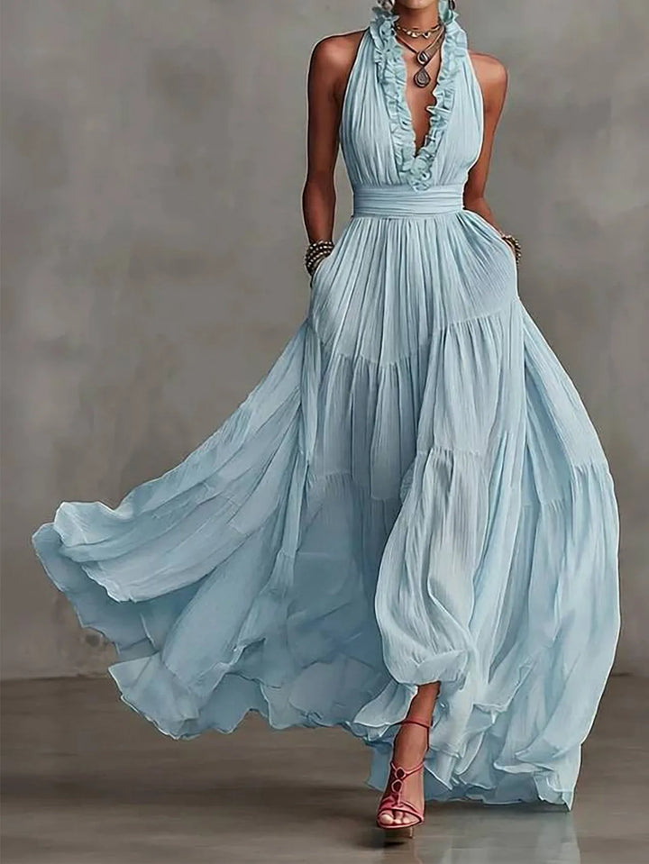 Stunning women's ruffle trim backless evening maxi dress with plunging neckline & pleated skirt.