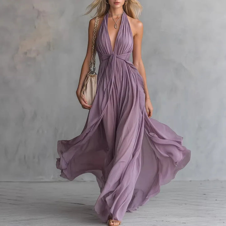 Elegant women's backless maxi evening dress. Flowy pleated design with a chic halter neck, perfect for formal wear.
