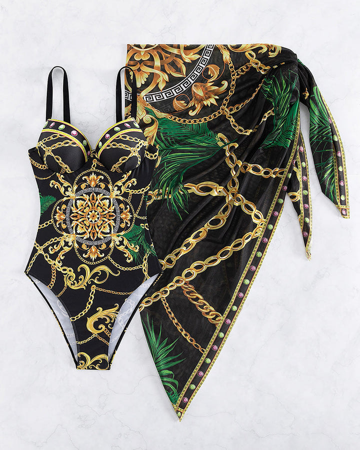 Stylish women's black baroque print one-piece swimsuit and wrap set, a chic vacation outfit.