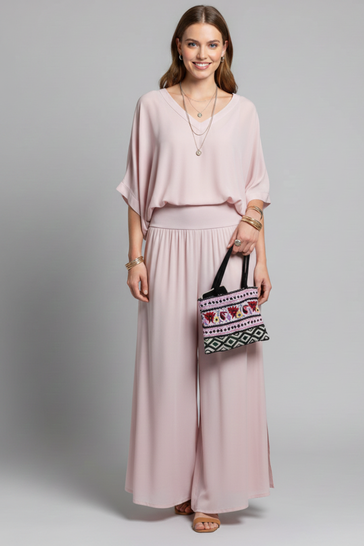 Sophisticated women's clothing set with an elegant batwing top and stylish wide leg pants.