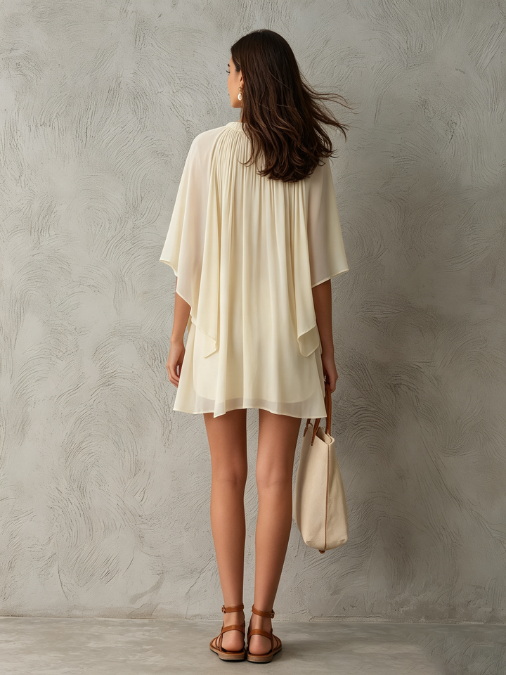 Short beige A-line mini dress with unique cape sleeves and a gathered neckline, an elegant choice for women.