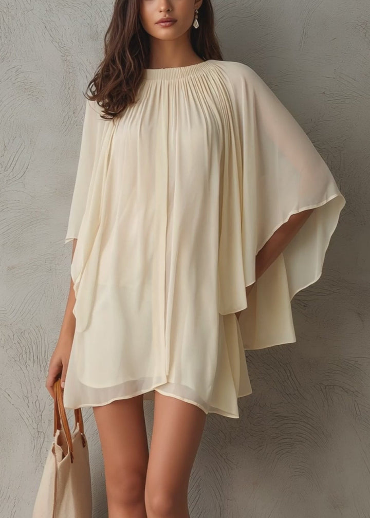 Women's effortless beige mini dress with chic cape sleeves, a versatile and elegant short summer party dress.