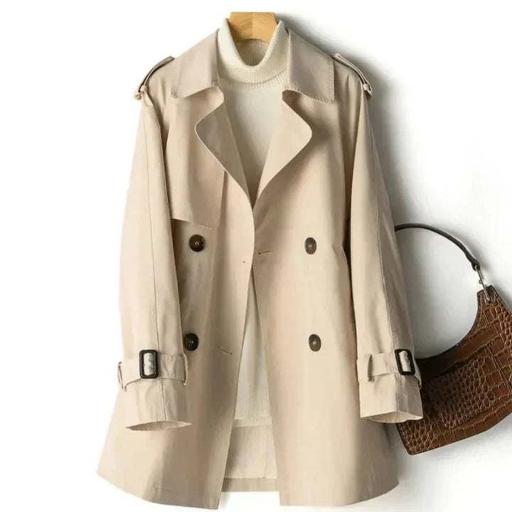 Elegant women's belted double-breasted trench coat for classic fall office wear and versatile outerwear style.