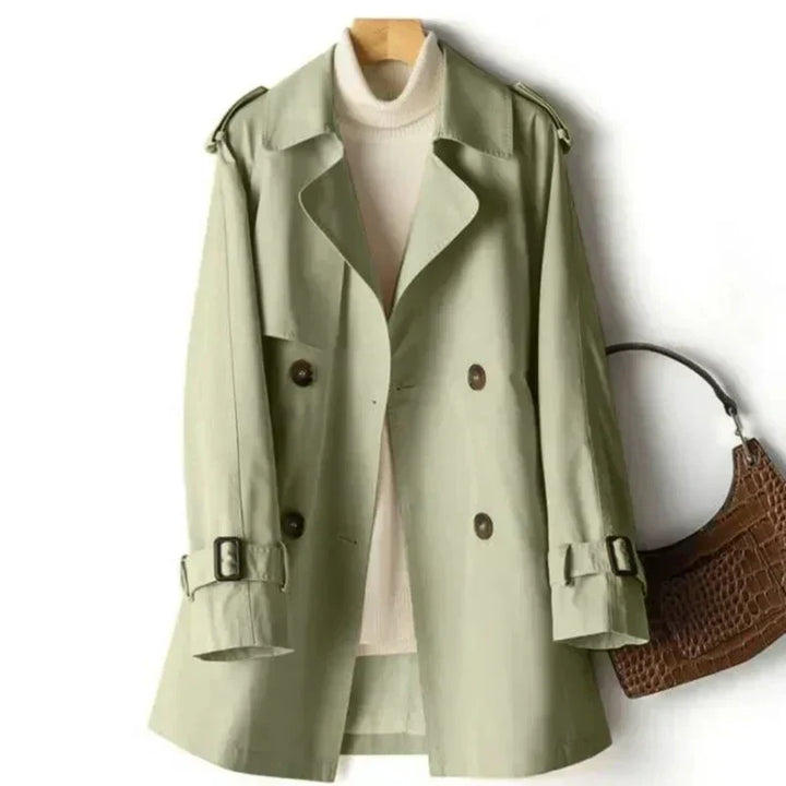 Stylish women's belted double-breasted trench coat, ideal for versatile fall outerwear, elegant and classic office wear.