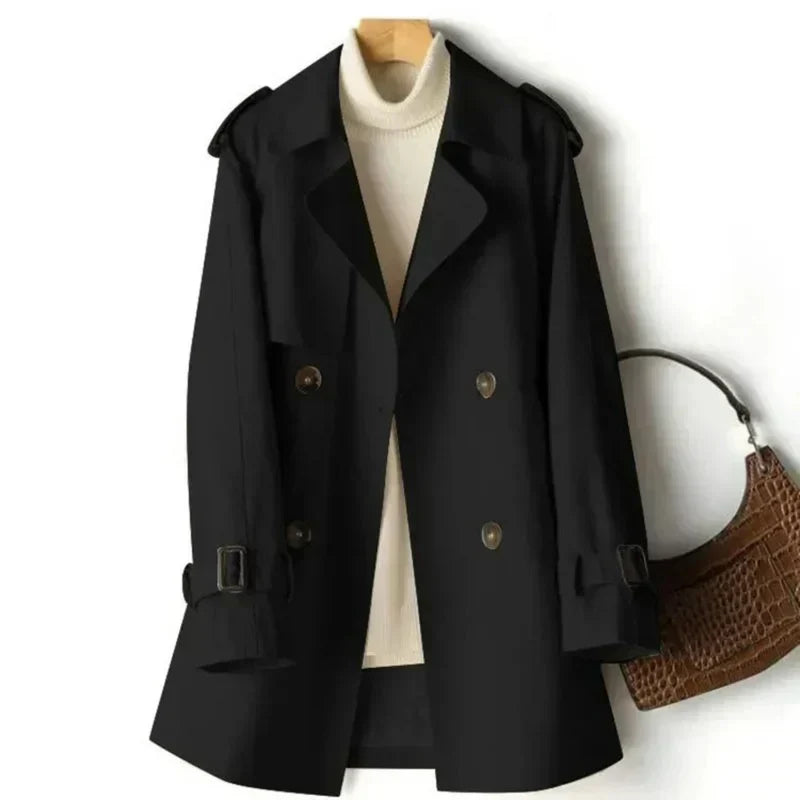 Sophisticated women's belted double-breasted trench coat, a classic and elegant fall outerwear piece for formal occasions.