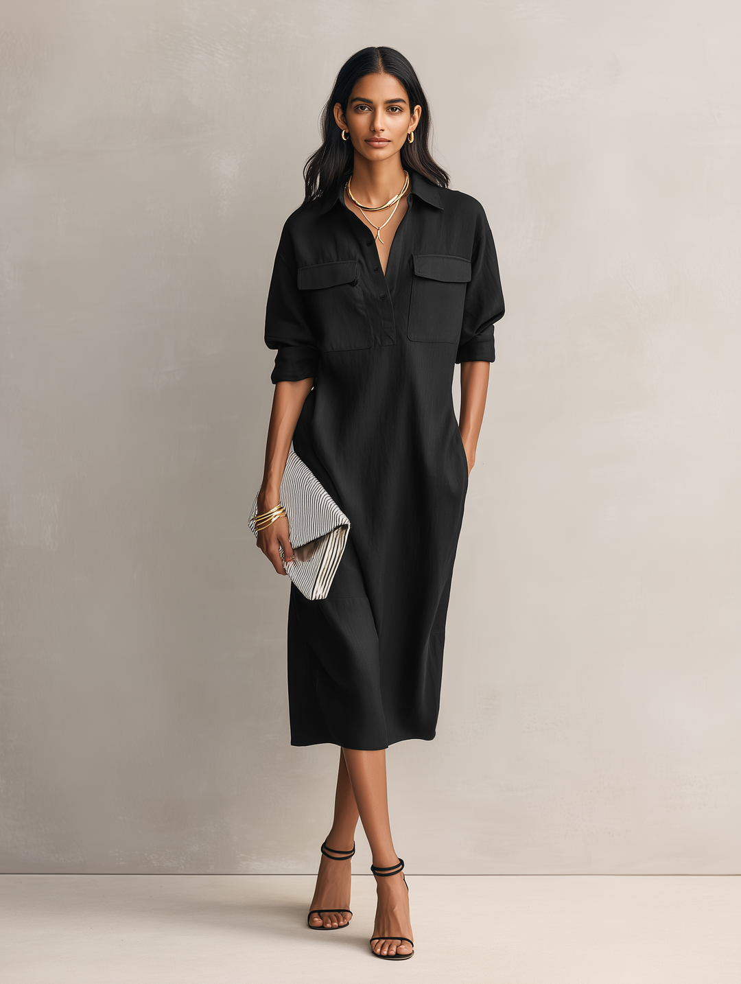 Black short sleeve midi dress for women, designed with an elegant shirt collar. A versatile piece for casual or work occasions.