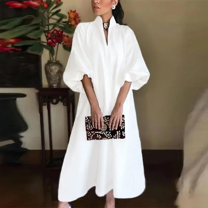 Elegant women's black midi dress with stand collar, puff sleeves, and A-line silhouette, perfect for formal events.