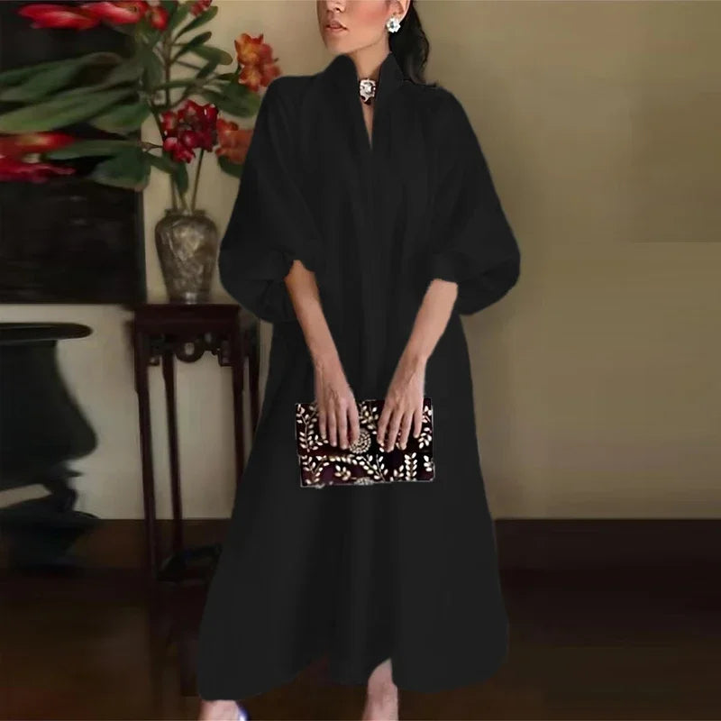 Sophisticated women's cocktail dress featuring a stand collar, puff sleeves, and A-line cut for parties & galas.