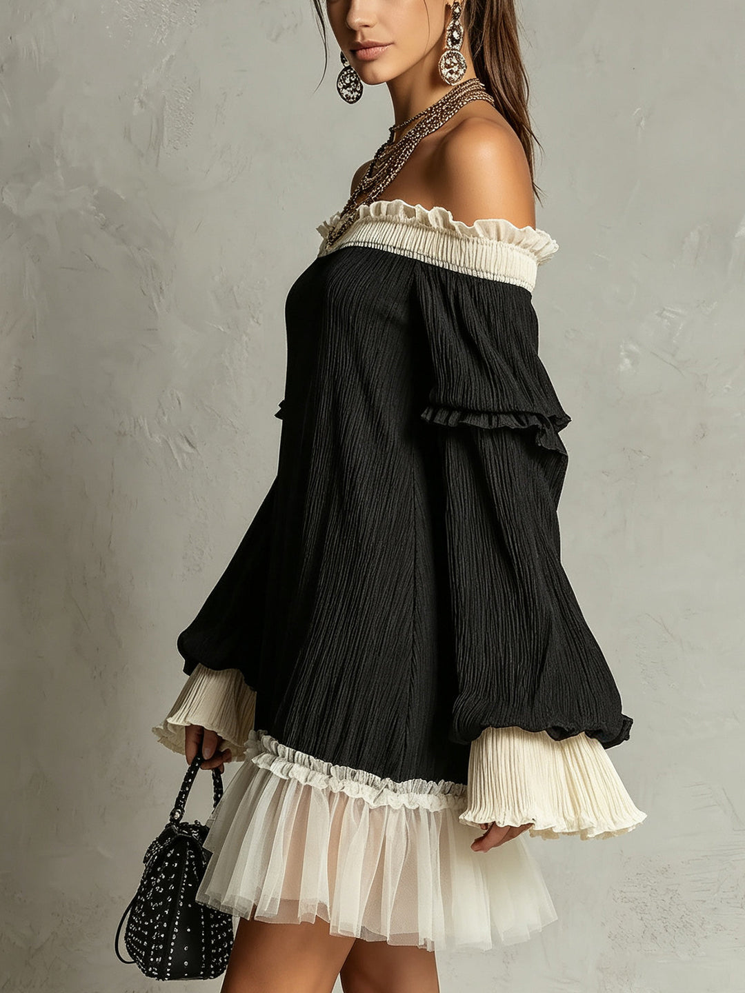 Chic black off-shoulder mini dress for women, featuring elegant ruffle sleeves & delicate lace trim details.