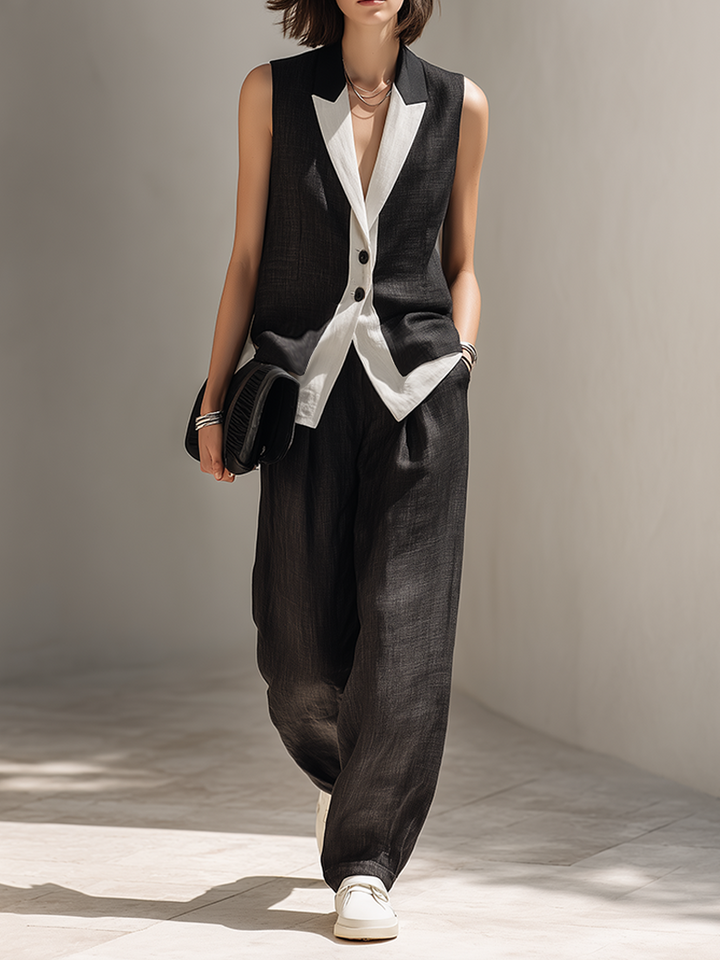 Elegant women's black tailored vest and wide-leg pants matching two-piece set for office or evening wear.