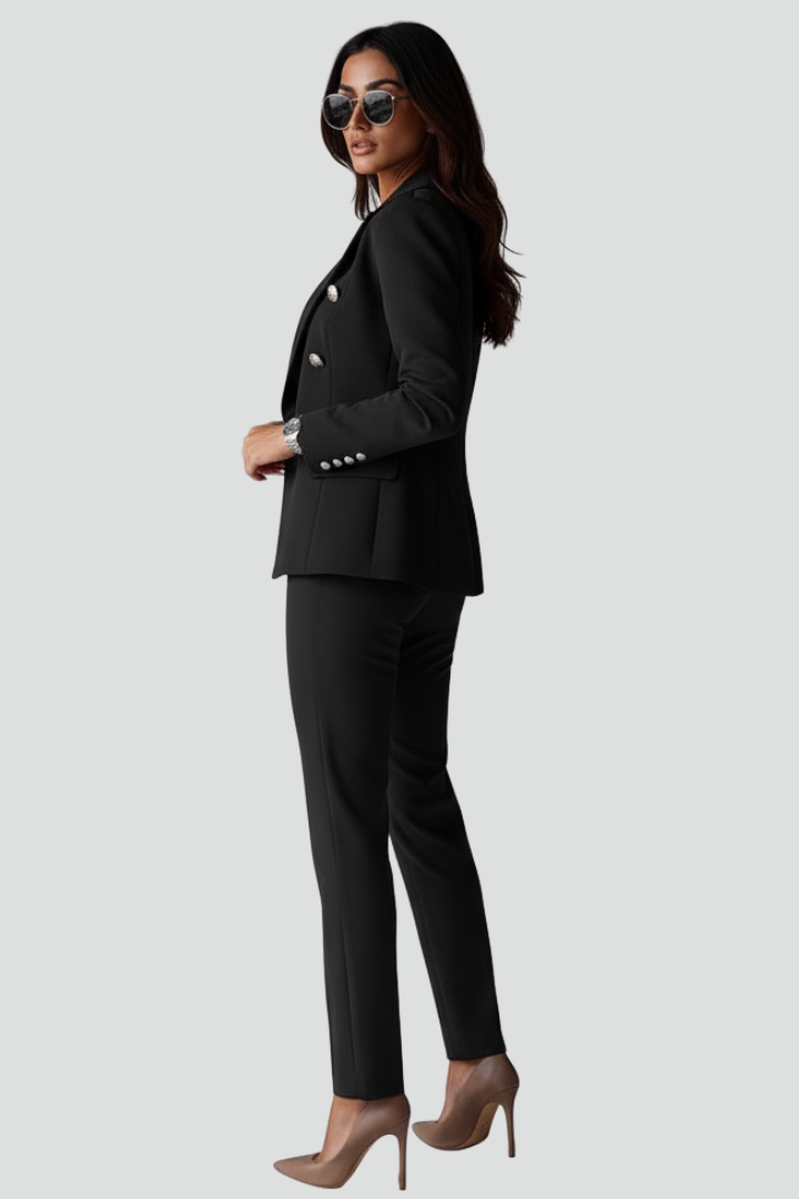 Close-up of the fabric and button detail on the women's elegant blazer, showcasing quality design.