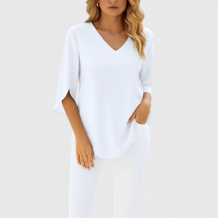 Chic women's split sleeve blouse. Modern, elegant fashion top, versatile for casual or dressy occasions.
