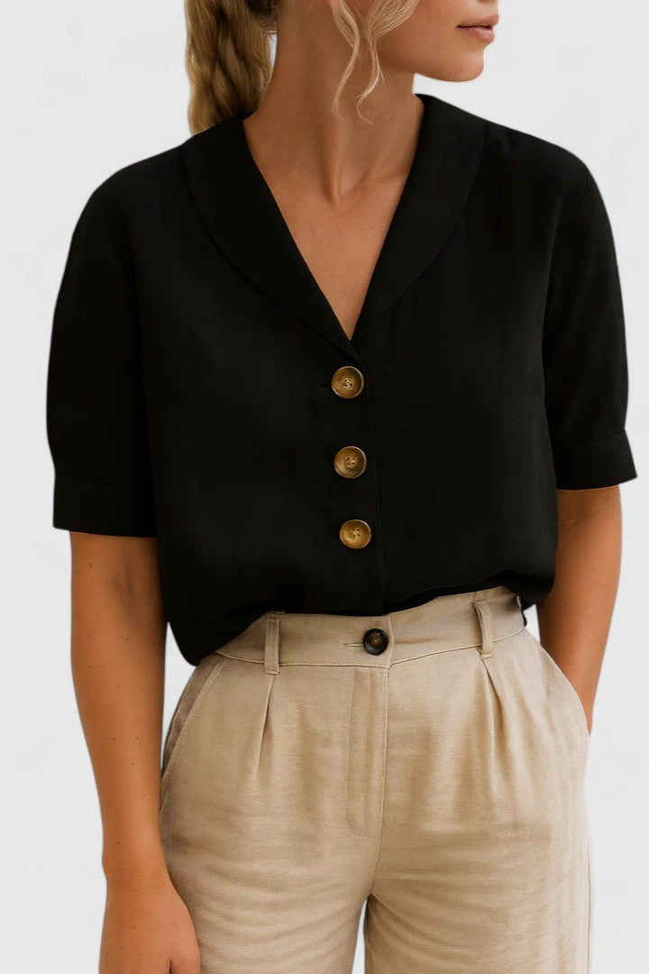 Fashionable women's elegant blouse featuring button details. A breathable, lightweight top for comfortable office or weekend style.