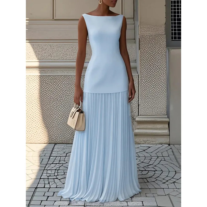 Modern classic women's sleeveless maxi dress. Features a boat neck and elegant pleats, great for summer fashion.