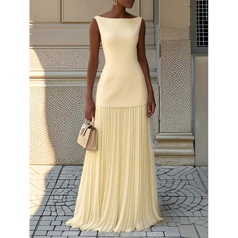Comfortable women's sleeveless maxi dress with boat neck. Flowy pleated design, versatile for casual wear or parties.