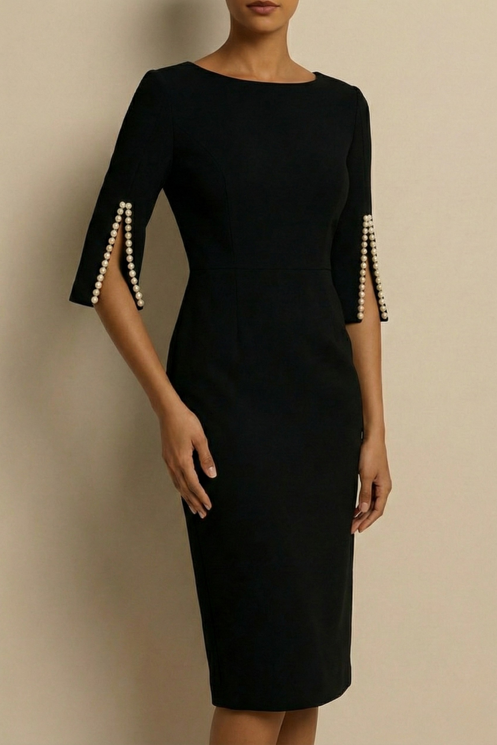 Stylish black bodycon midi dress, ideal for wedding guests & cocktail parties, featuring chic pearl detailed split-sleeves.