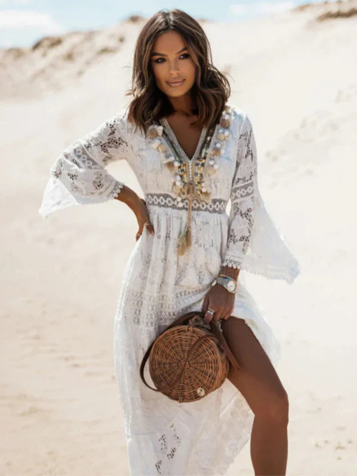 Boho women's maxi dress featuring a chic V-neck, intricate lace bodice, & stylish flared sleeves for summer.