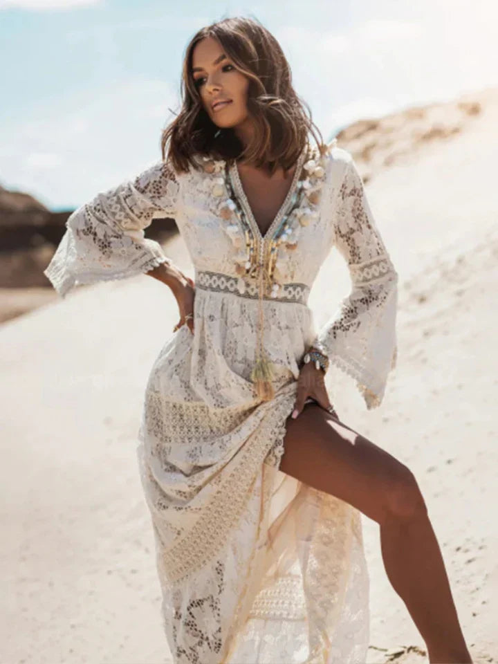 Flowy bohemian summer maxi dress for women, with elegant lace accents & flared sleeves, ideal for casual wear.