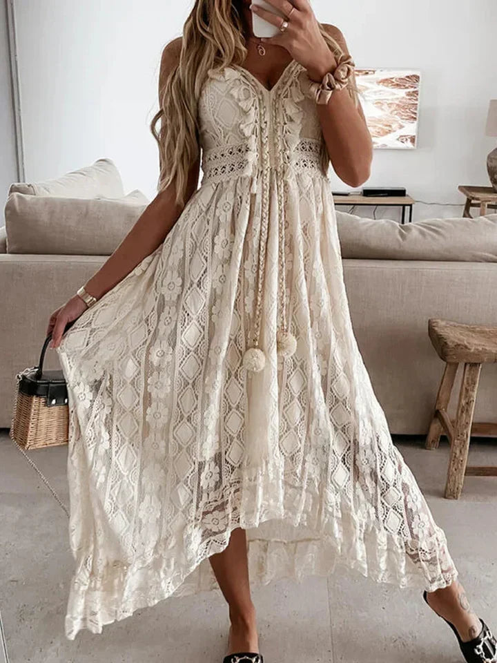 Vibrant women's bohemian maxi dress, featuring delicate lace, a flattering V-neck, & stylish flared sleeves.