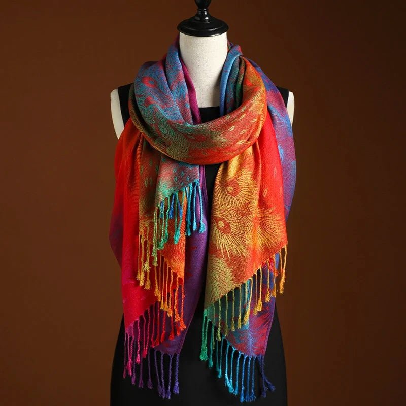 Elegant women's bohemian shawl with vibrant peacock pattern and long fringe. Perfect fashion accessory.