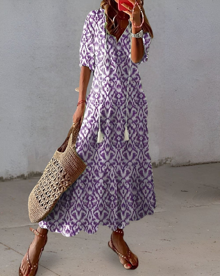 Flowy women's summer maxi dress with elegant floral prints. Comfortable bohemian style long dress.