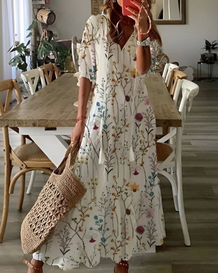 Bohemian women's fashion maxi dress with elegant floral patterns. Flowy long summer style.
