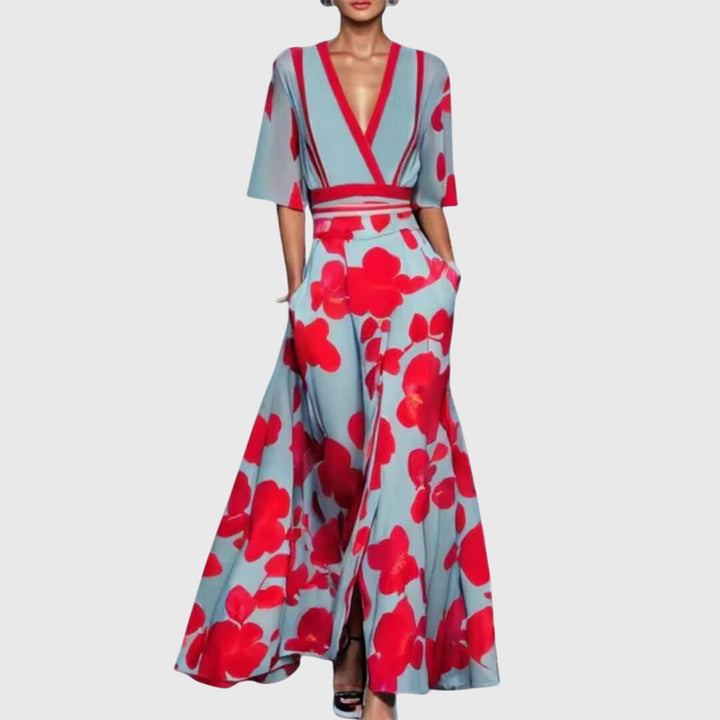 Stylish women's bold floral deep V-neck maxi dress with flowy design & practical pockets. Statement summer fashion.
