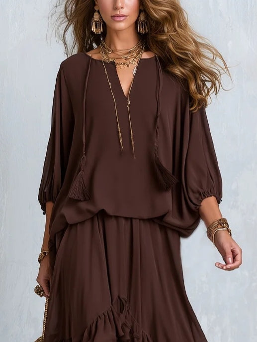 Effortless women's brown long-sleeve wrap maxi dress with V-neck & tiered ruffle hem. Elegant and comfortable autumn style.