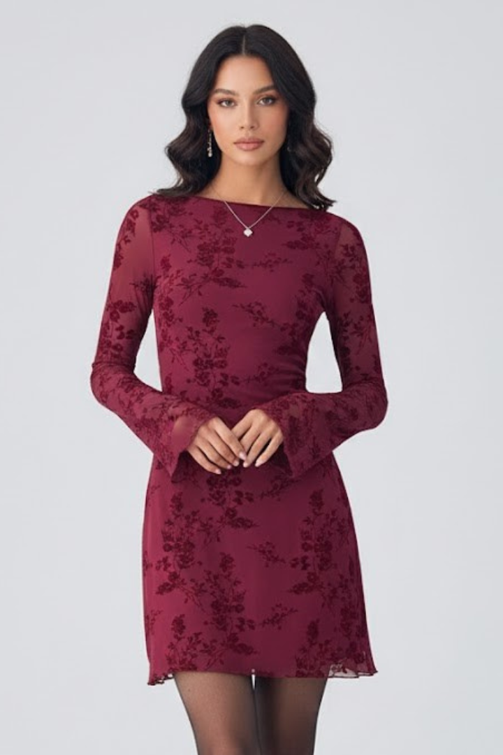 Women's elegant floral mini cocktail dress with ruched waist detail, perfect for evenings.