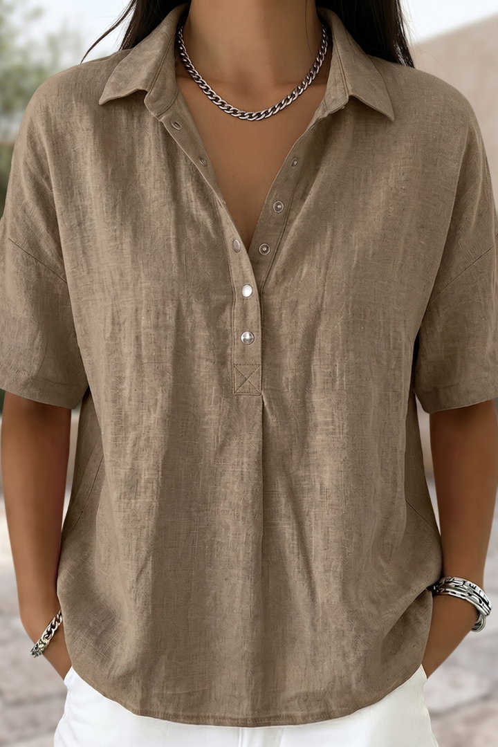 Elegant women's button-up blouse, long sleeve, perfect for office work or casual chic everyday style. Versatile fashion top.