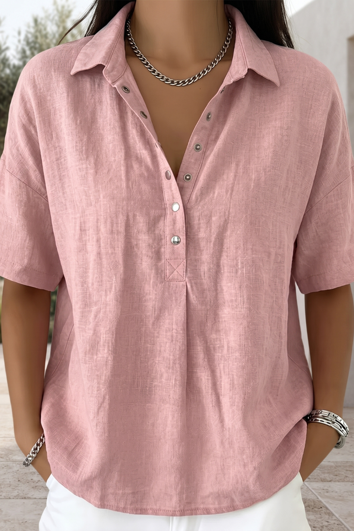 Sophisticated women's blouse, button-up design. Timeless long sleeve top for elegant work wear or casual spring outfits.