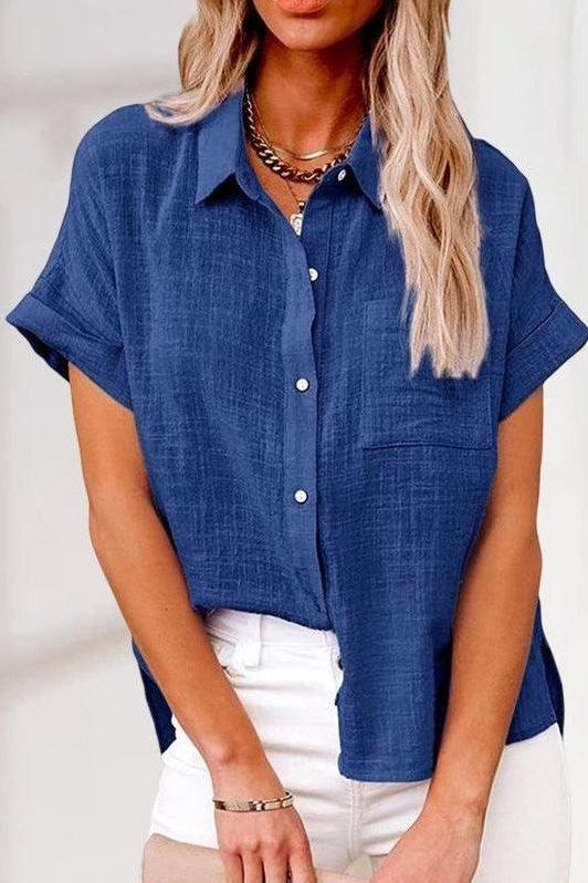 Tailored fit women's button-up shirt with long sleeves. Elegant blouse for a polished and professional look.