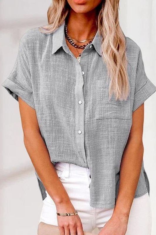Polished women's button-up shirt, elegant everyday style. Long sleeve blouse, perfect for versatile fashion.