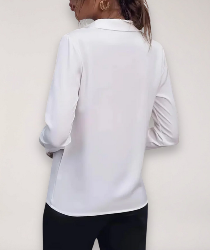 Stylish women's long-sleeve buttoned shirt, a professional blouse for office wear and versatile work attire.