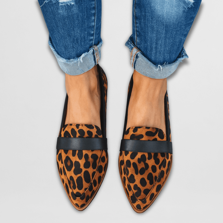 Comfortable women's camel pointed-toe flat loafers. Elegant slip-on shoes for women, great for work or daily style.